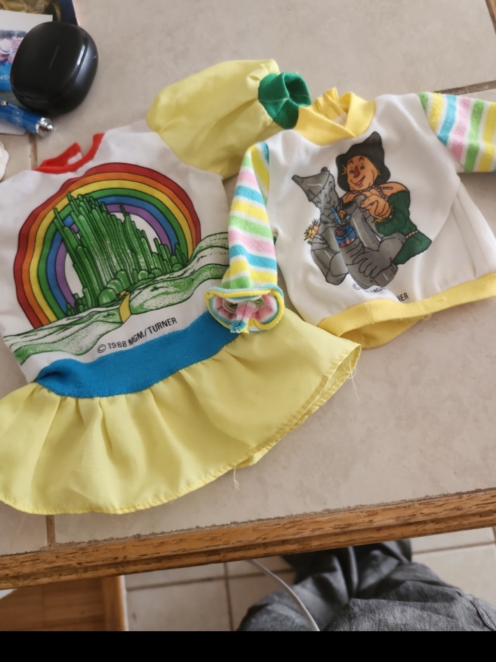 1988 MGM/Turner Wizard of Oz doll dress features a graphic of the Emerald City